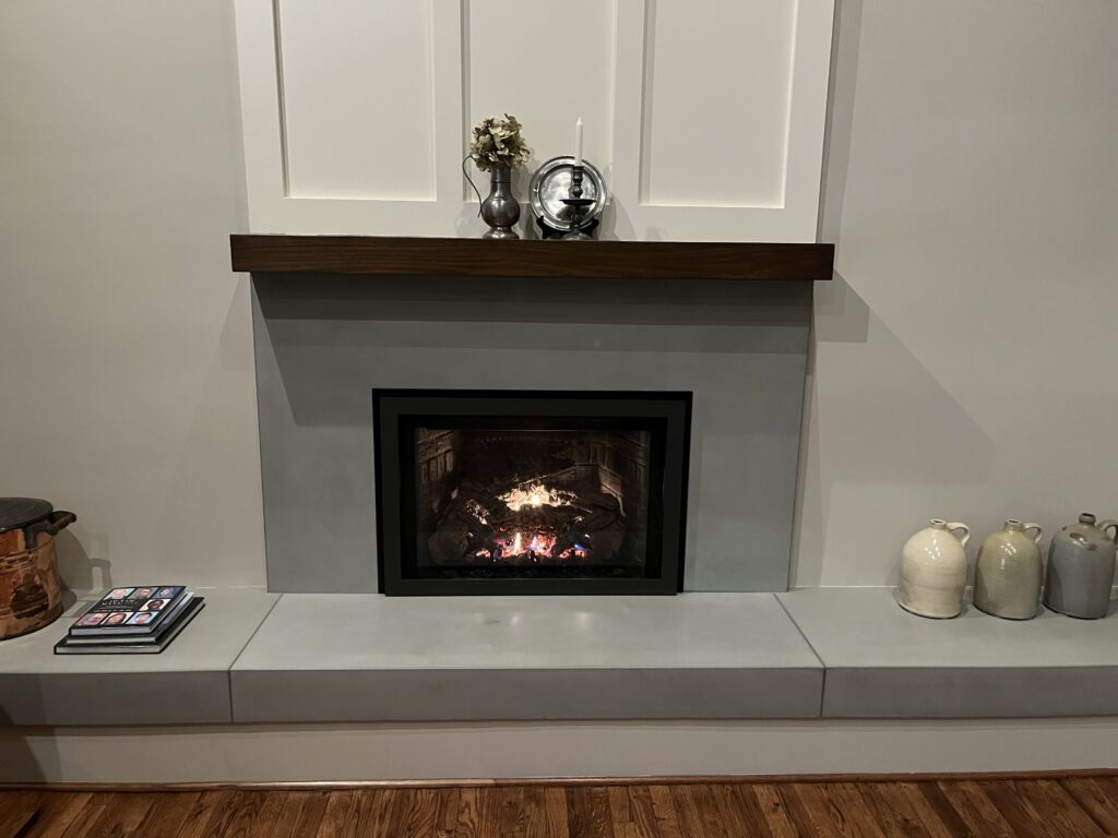 An architectural concrete element design of a fireplace.