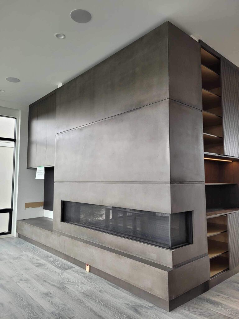 An architectural concrete element design of a commercial fireplace in an large building